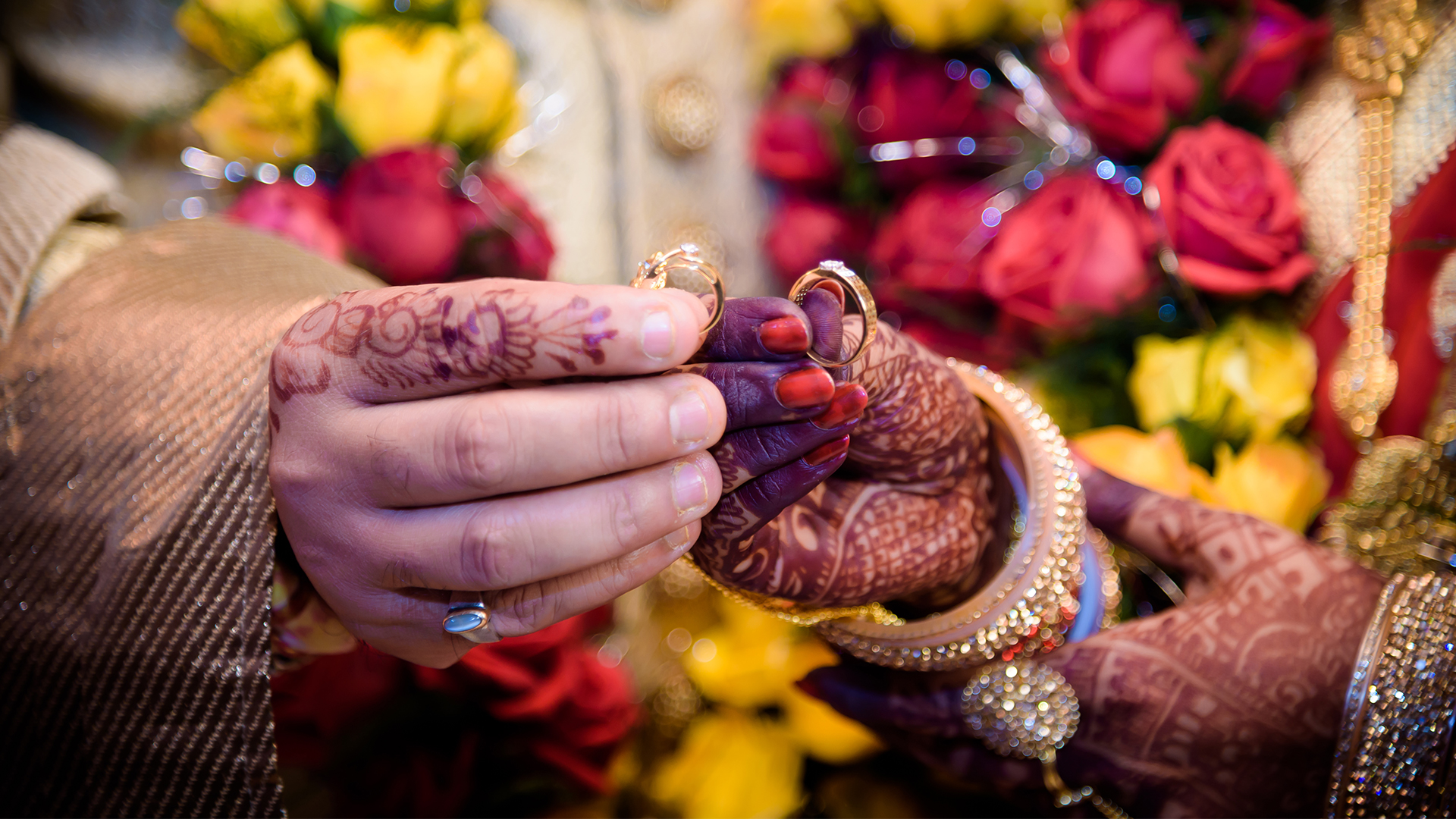 Sikh wedding couple on bridge at Prested Hall Essex