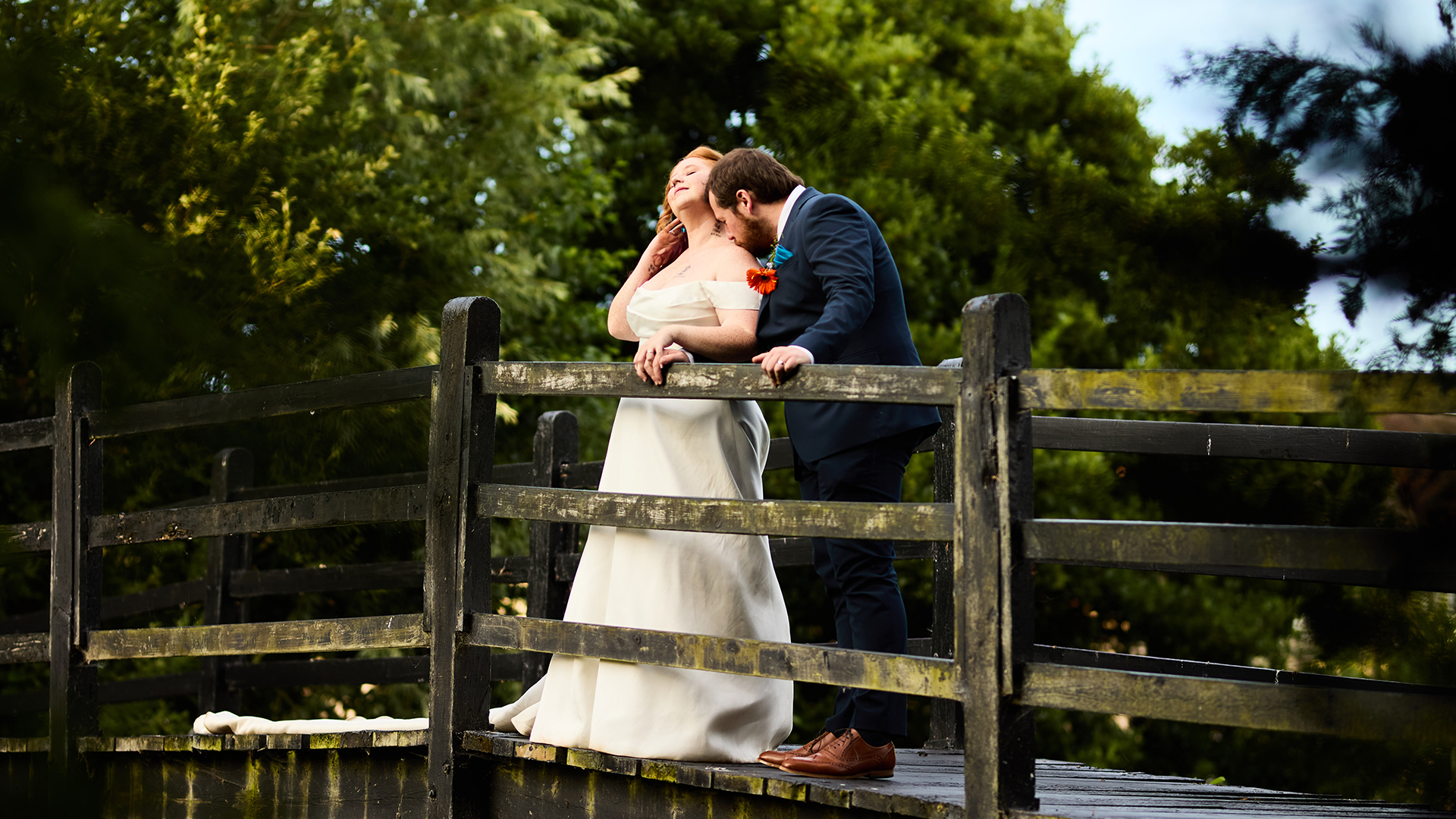 Prested Hall photoshoot spots – couple on the moated bridge at golden hour, wedding photography in Essex