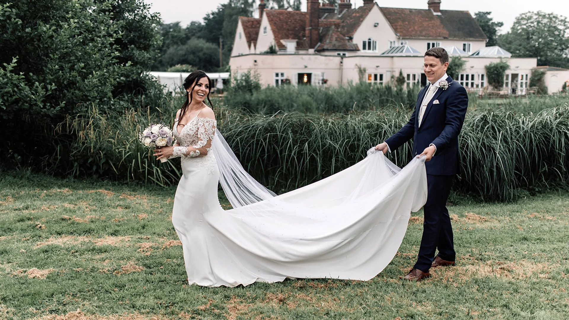 Bride and groom outside the historic Prested Hall wedding venue in Essex